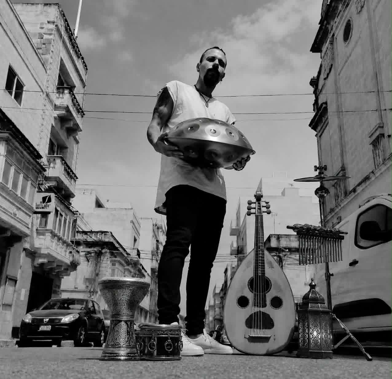 The full spread — handpan, darbuka, oud